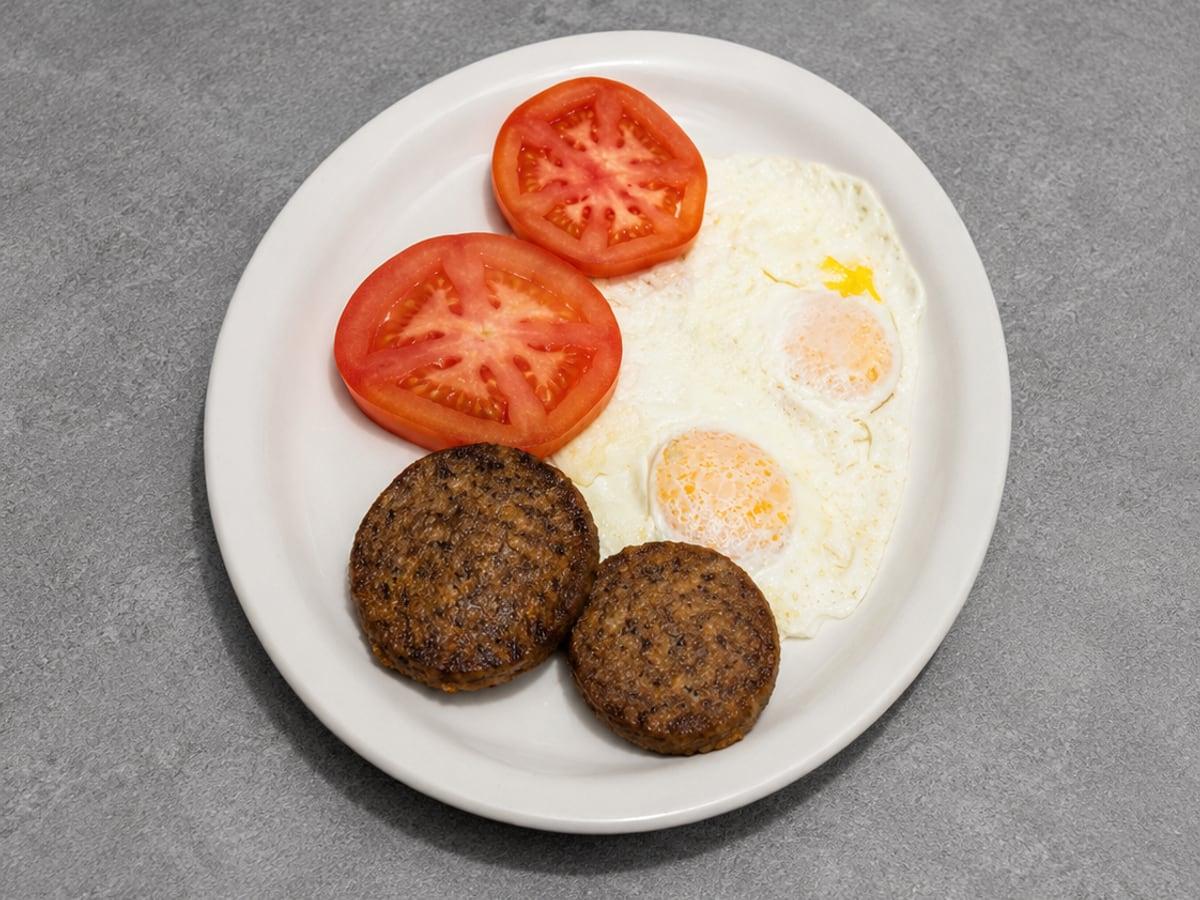 Two Eggs with Bacon or Sausage served at Ranch House Makarios Family Restaurant in Vestavia Hills
